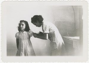 Nurse_immunizing_young_girl_in_dress,_1930's_(16429990127)