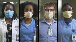 four providers wearing masks